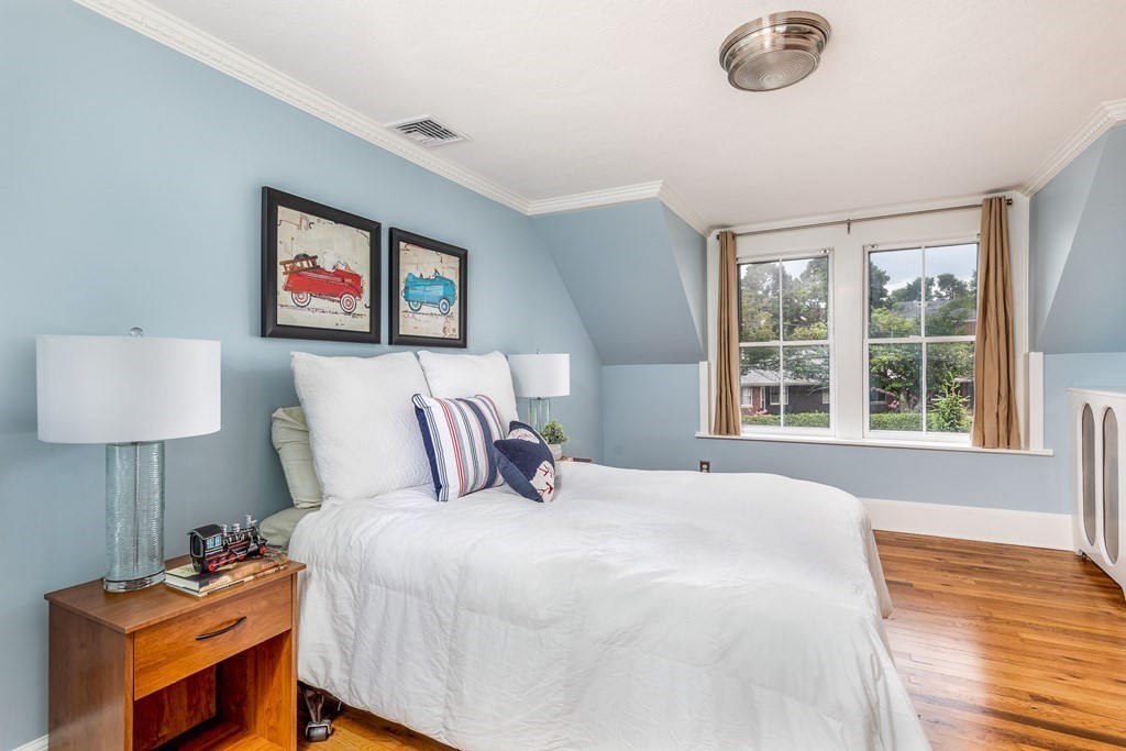 3 Lattimer Street Marblehead, MA 01945 - Photo 33 of 42 a bedroom with a bed and a lamp on table
