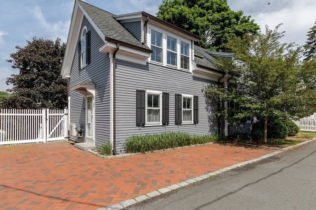 3 Lattimer Street Marblehead, MA 01945 - Photo 41 of 42 a front view of a house with a yard and garage
