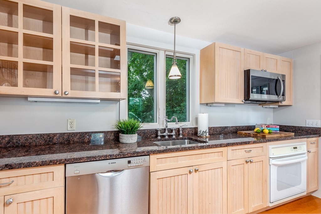 3 Lattimer Street Marblehead, MA 01945 - Photo 5 of 42 a kitchen with stainless steel appliances granite countertop a stove a sink and a granite counter tops