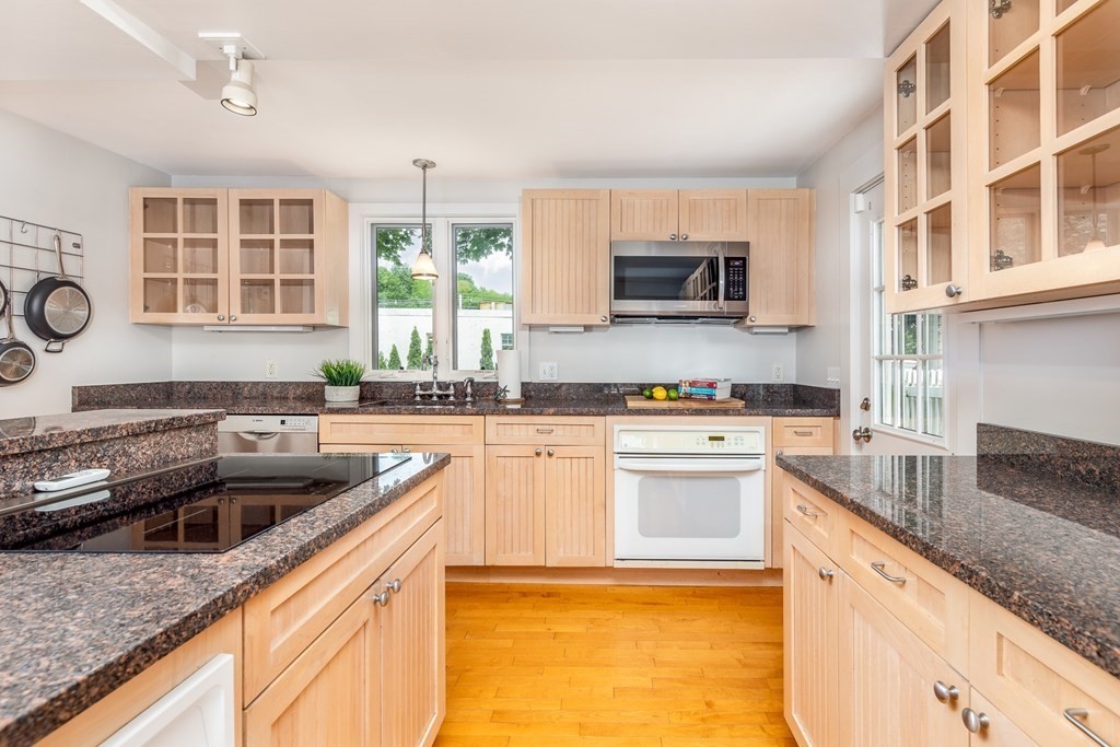 3 Lattimer Street Marblehead, MA 01945 - Photo 6 of 42 a kitchen with granite countertop a sink and a stove top oven