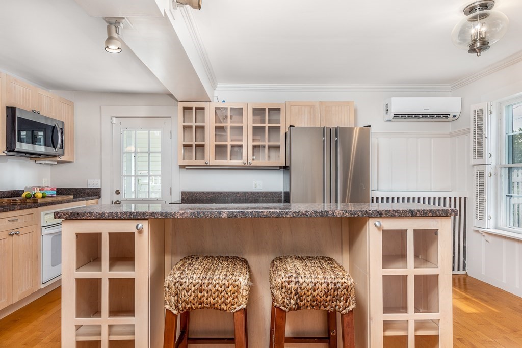 3 Lattimer Street Marblehead, MA 01945 - Photo 9 of 42 a kitchen with stainless steel appliances granite countertop a stove a sink and a refrigerator