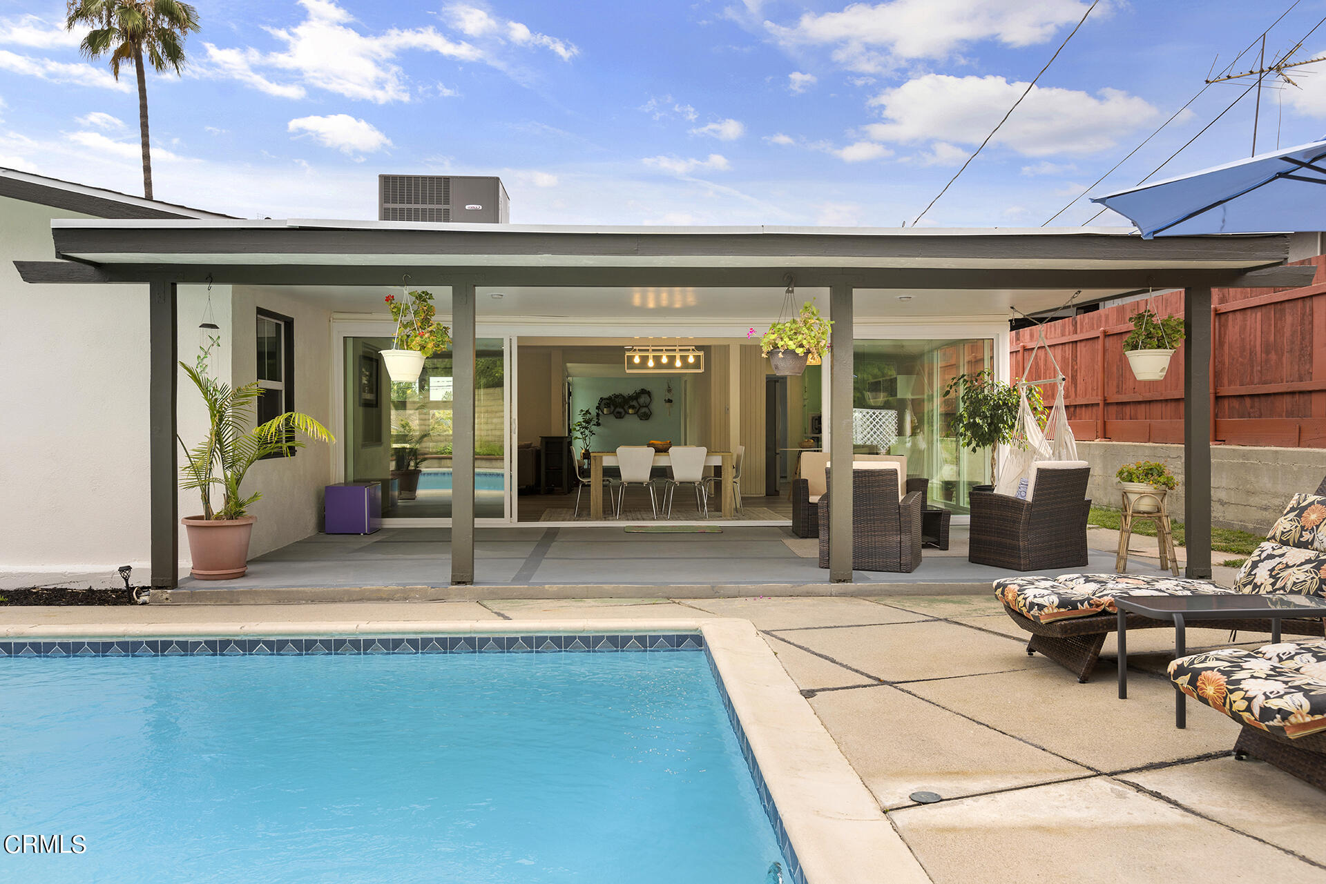 1130 Daveric Drive Pasadena, CA 91107 - Photo 16 of 21 a view of a patio with dining table and chairs with wooden floor