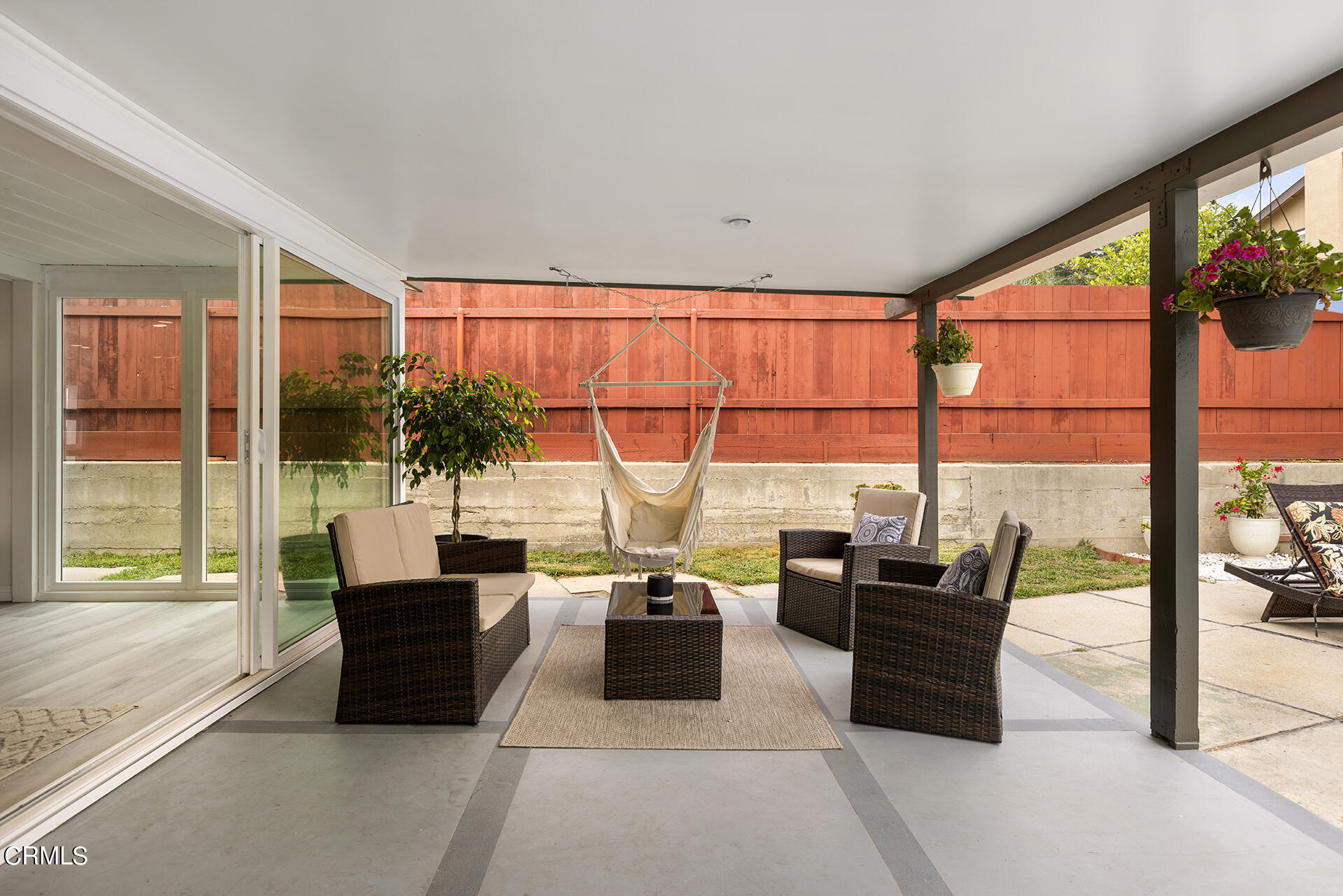1130 Daveric Drive Pasadena, CA 91107 - Photo 18 of 21 a living room with furniture a flat screen tv and a floor to ceiling window