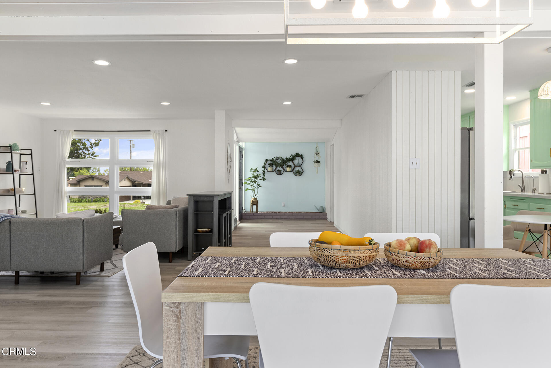 1130 Daveric Drive Pasadena, CA 91107 - Photo 4 of 21 a living room with furniture a wooden floor and kitchen view