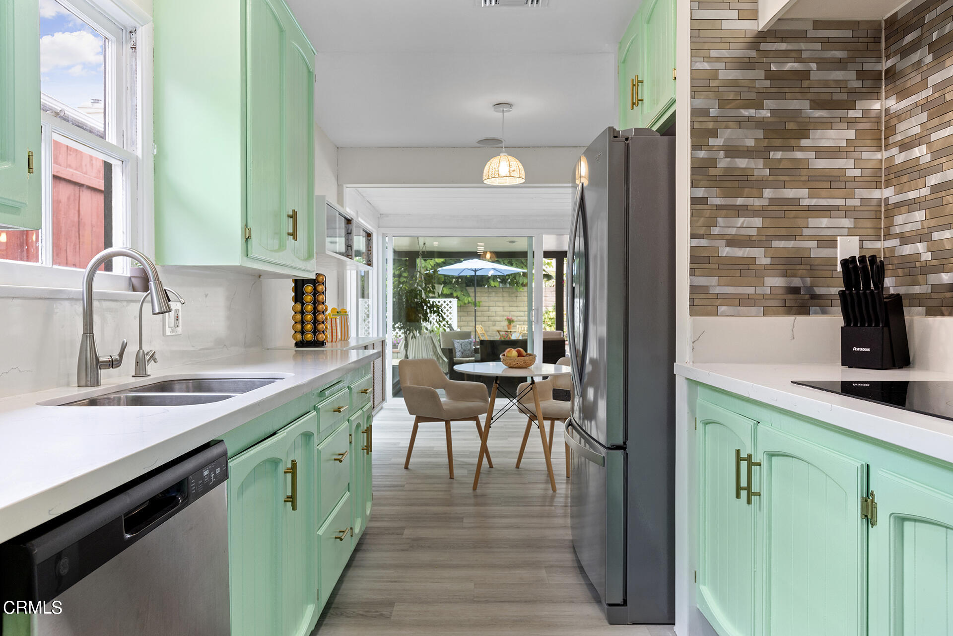 1130 Daveric Drive Pasadena, CA 91107 - Photo 9 of 21 a kitchen with cabinets a sink and appliances
