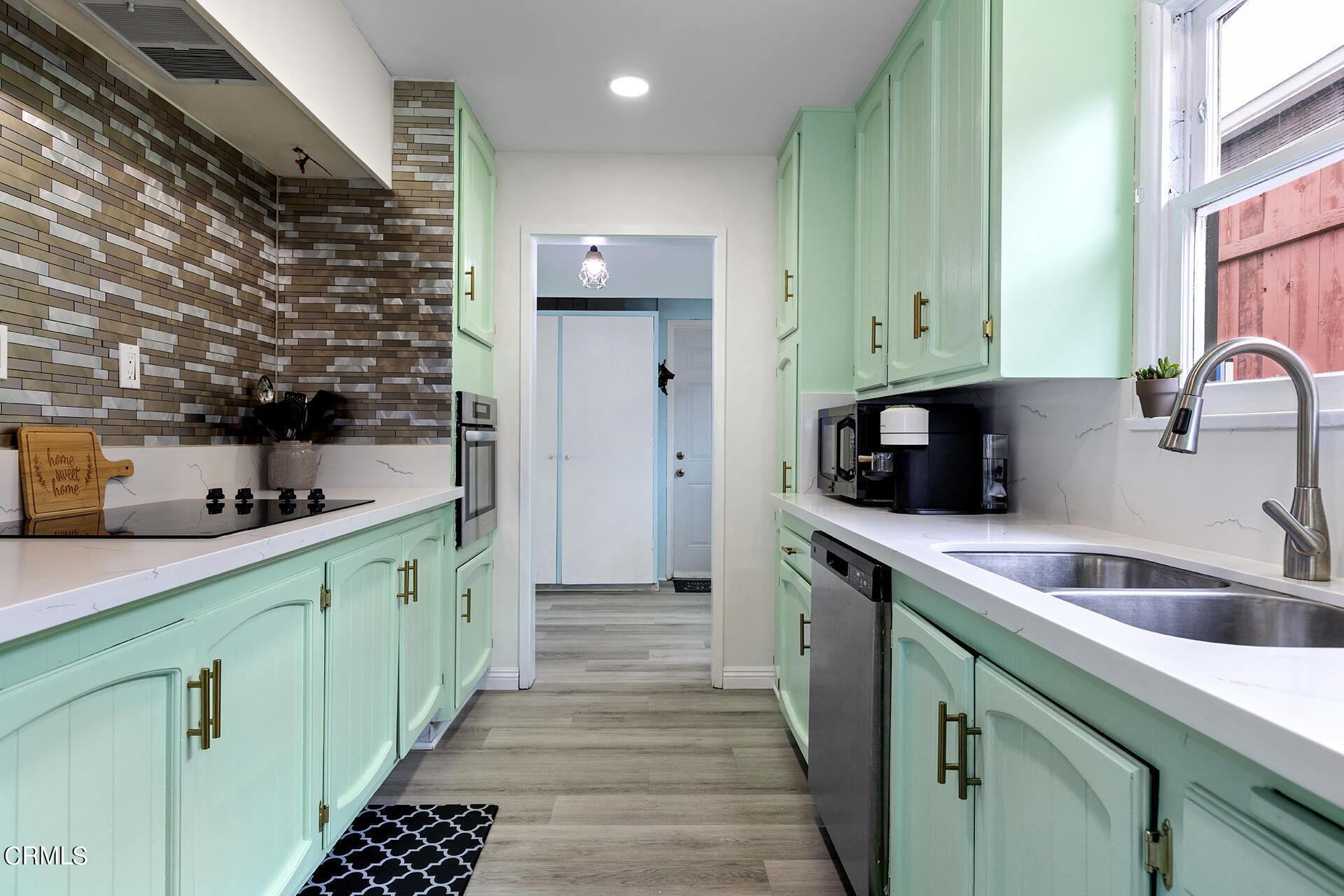 1130 Daveric Drive Pasadena, CA 91107 - Photo 10 of 21 a kitchen with a sink and cabinets