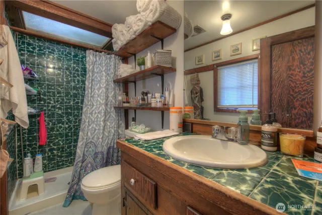 a room with wooden cabinets table and chairs