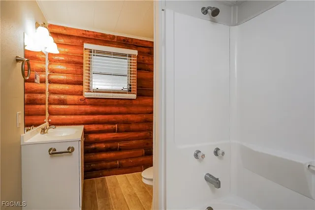 a bathroom with a bathtub and shower