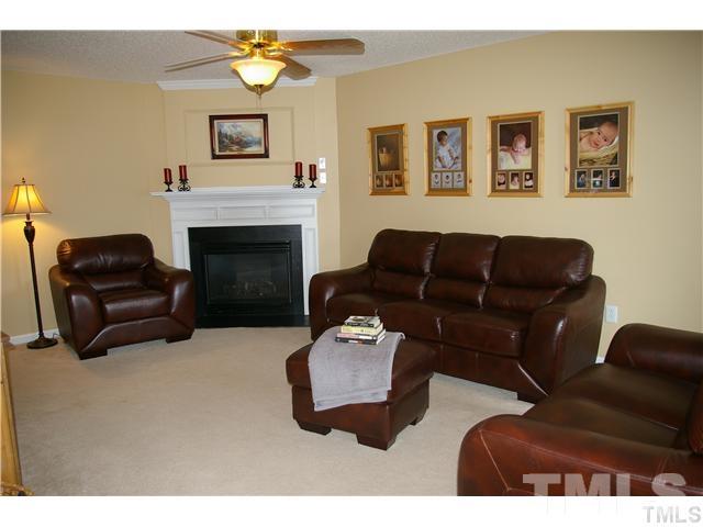 4501 Nightfall Court Durham, NC 27713 - Photo 3 of 11 a living room with furniture and a fireplace