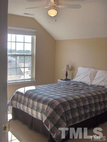 4501 Nightfall Court Durham, NC 27713 - Photo 8 of 11 a bedroom with a bed and window