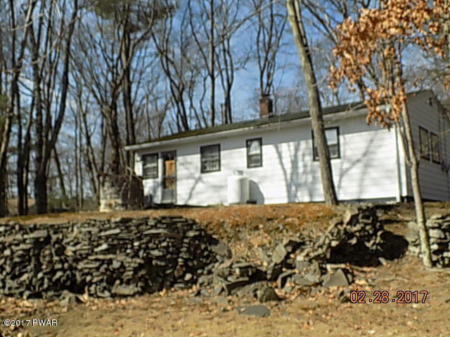136 Beech Road Dingmans Ferry, PA 18328 - Photo 6 of 13 a view of a house with snow on the yard