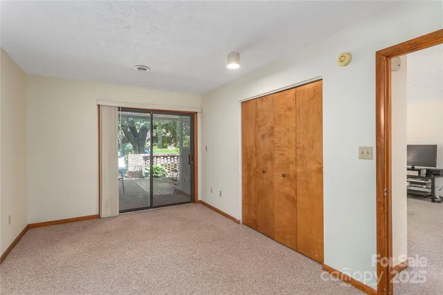 a bathroom with a sink a toilet and shower curtain