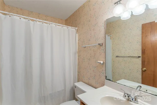 a balcony view with a seating space