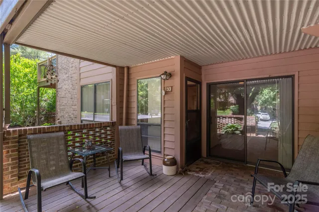 a view of balcony with wooden floor