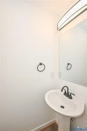 a bathroom with a sink and mirror