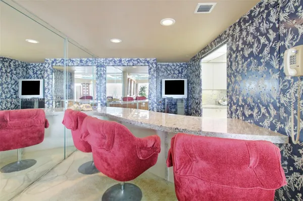 a living room with furniture fireplace and flat screen tv