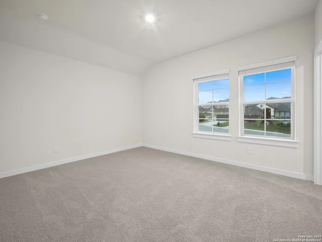 a view of a room that has a window in it