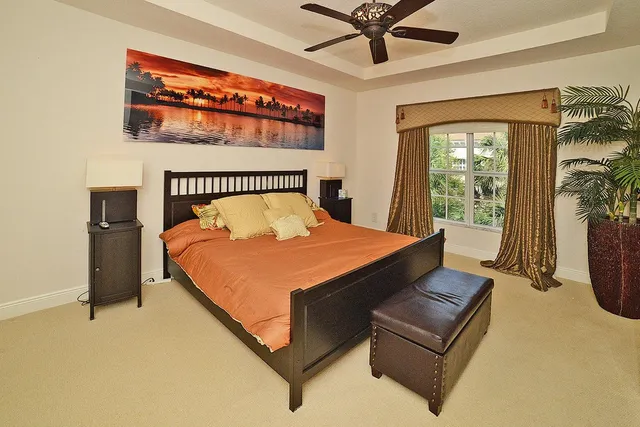 a view of a swimming pool and lounge chairs