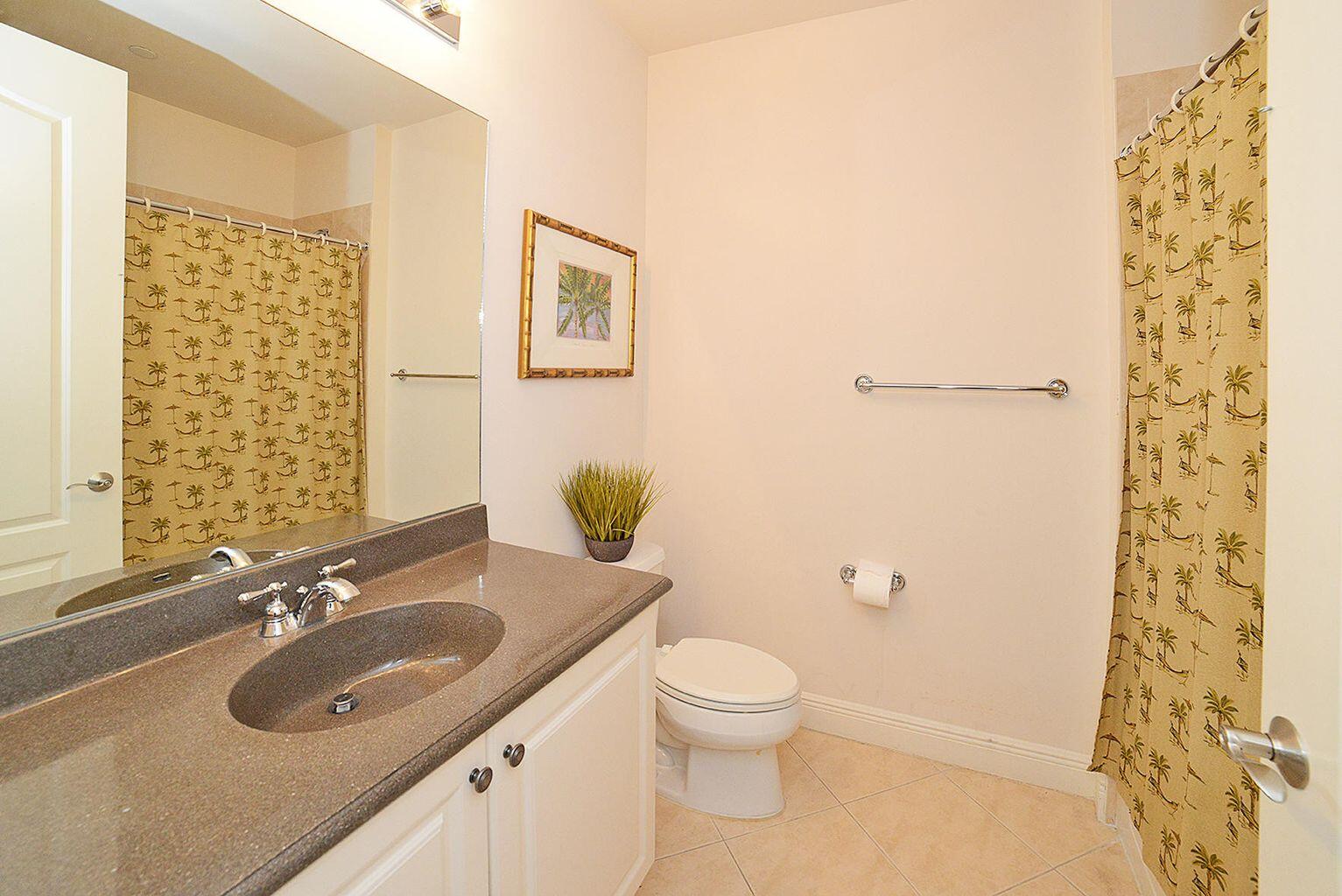 5510 Northeast Trieste Terrace Boca Raton, FL 33487 - Photo 6 of 19 a bathroom with a sink toilet and shower