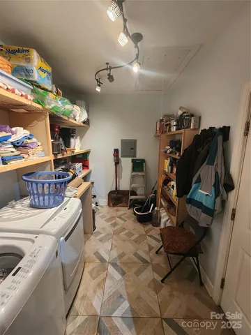 a living room with furniture a rug and a fireplace