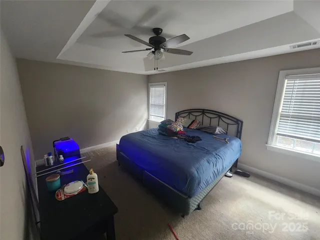 a room with furniture and view kitchen