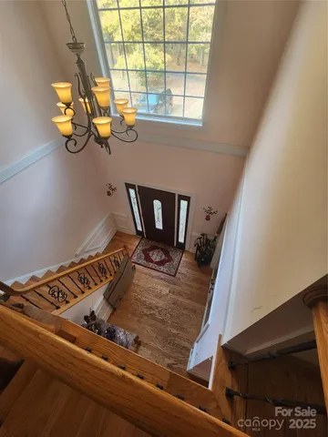 a bathroom with a toilet a sink and a mirror