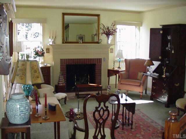 814 Lake Boone Trail Raleigh, NC 27607 - Photo 4 of 10 a living room with furniture and a fireplace