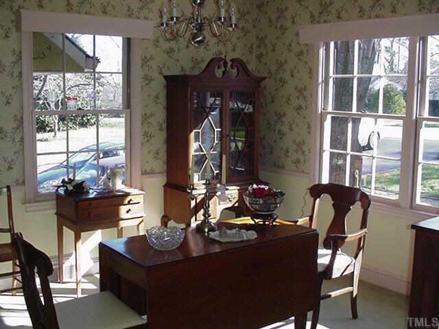 814 Lake Boone Trail Raleigh, NC 27607 - Photo 5 of 10 a living room with furniture and a large window