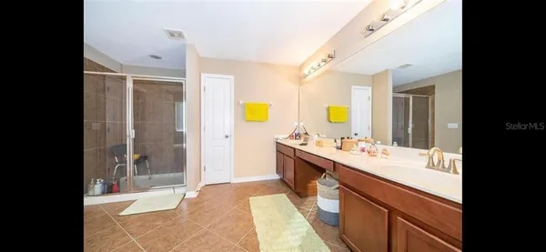 a kitchen with a sink and a refrigerator