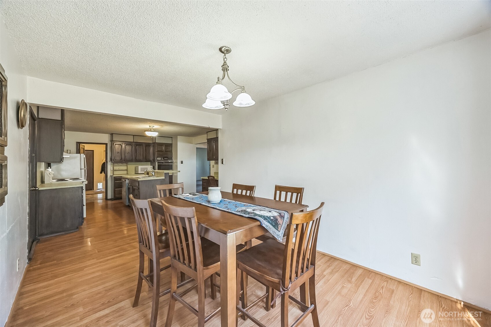 2420 Simpson Avenue Hoquiam, WA 98550 - Photo 12 of 32 a view of a dining room with furniture and wooden floor