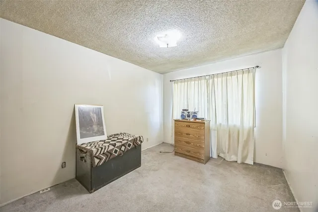 a room with a bed and furniture