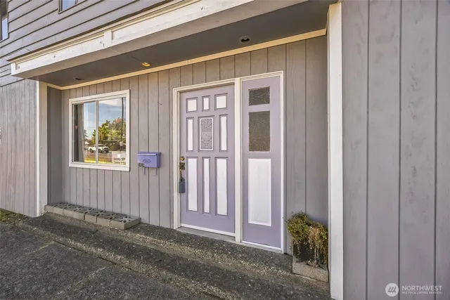 a view of porch with a door and a window