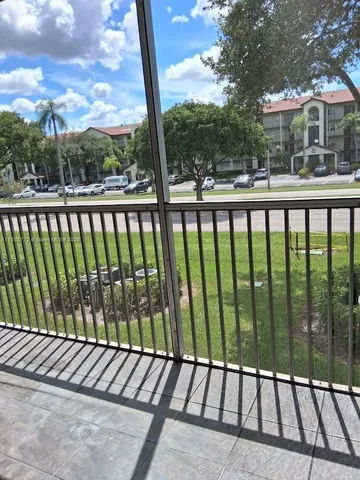 a view of a street view from a balcony