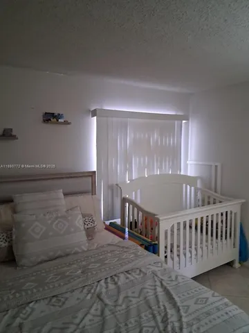 a bed room with a bed and a window