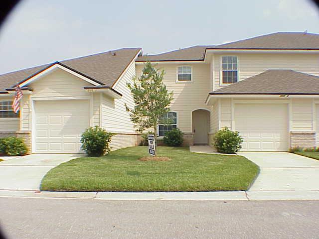 205 Long Bridge Road Fruit Cove, FL 32259 - Photo 1 of 1 a front view of a house with a yard and garage