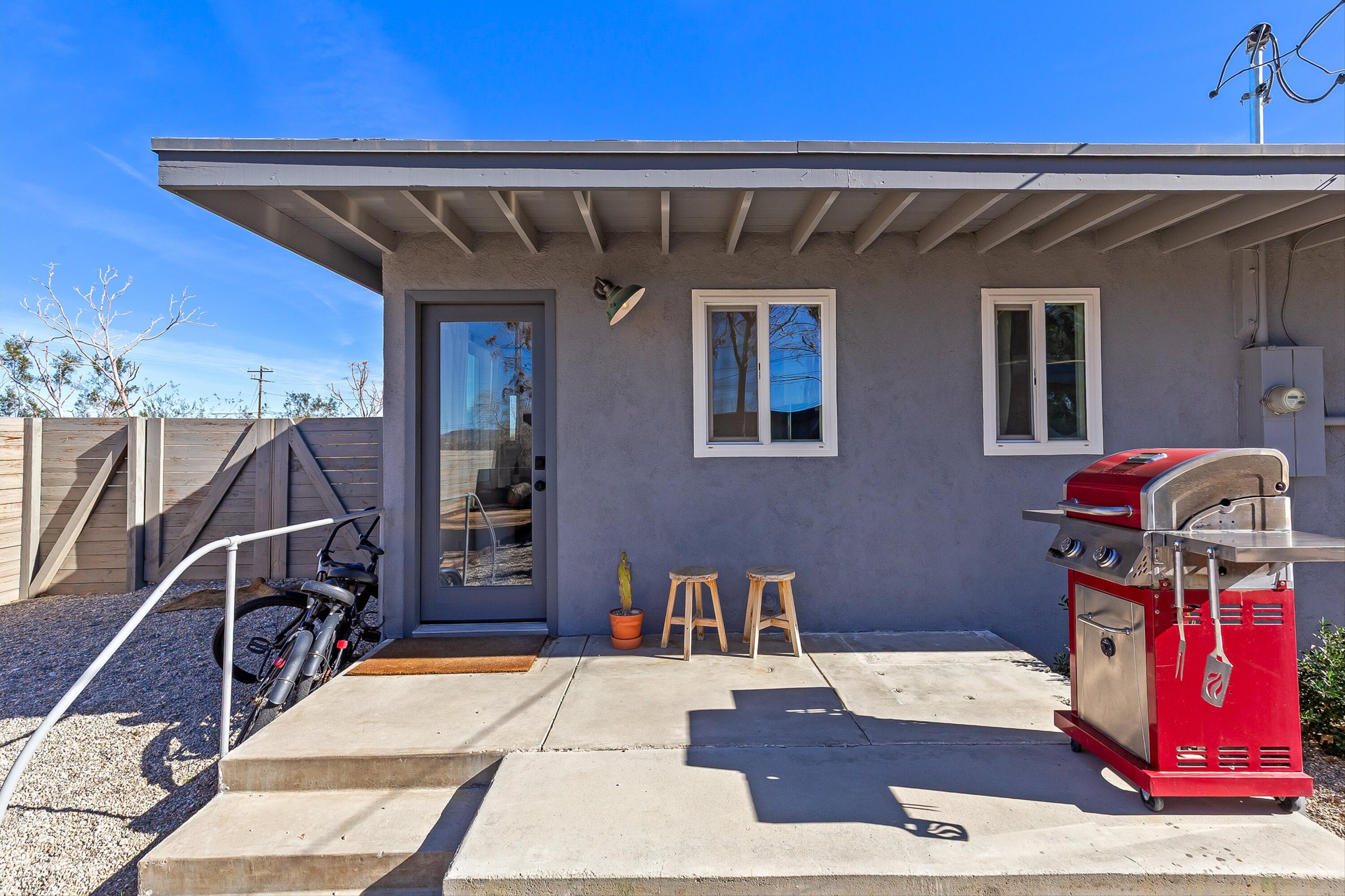 62010 El Reposo Circle Joshua Tree, CA 92252 - Photo 16 of 28 a view of entryway with a couch