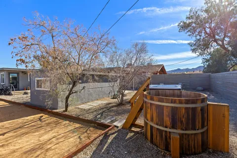 a view of a roof deck with wooden fence