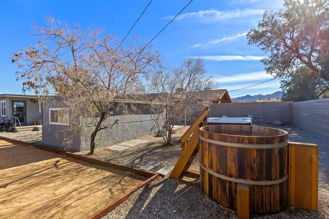 a view of a roof deck with wooden fence