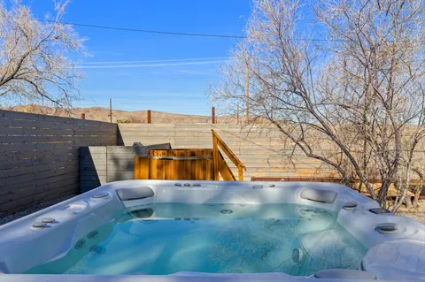 a view of a swimming pool with a yard
