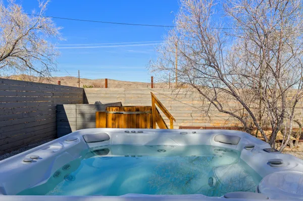 a view of a swimming pool with a yard