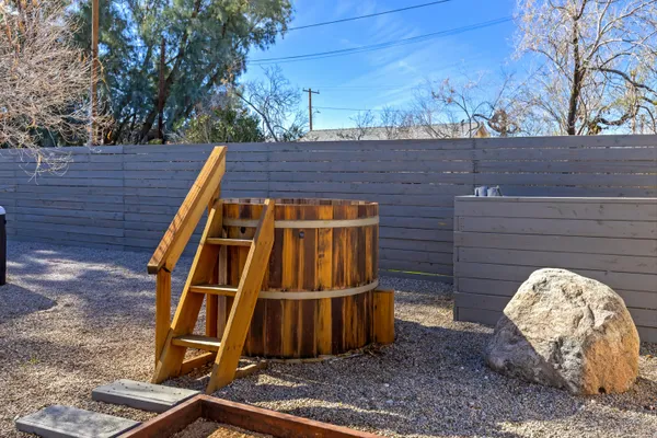 a view of a wooden door with an outdoor space