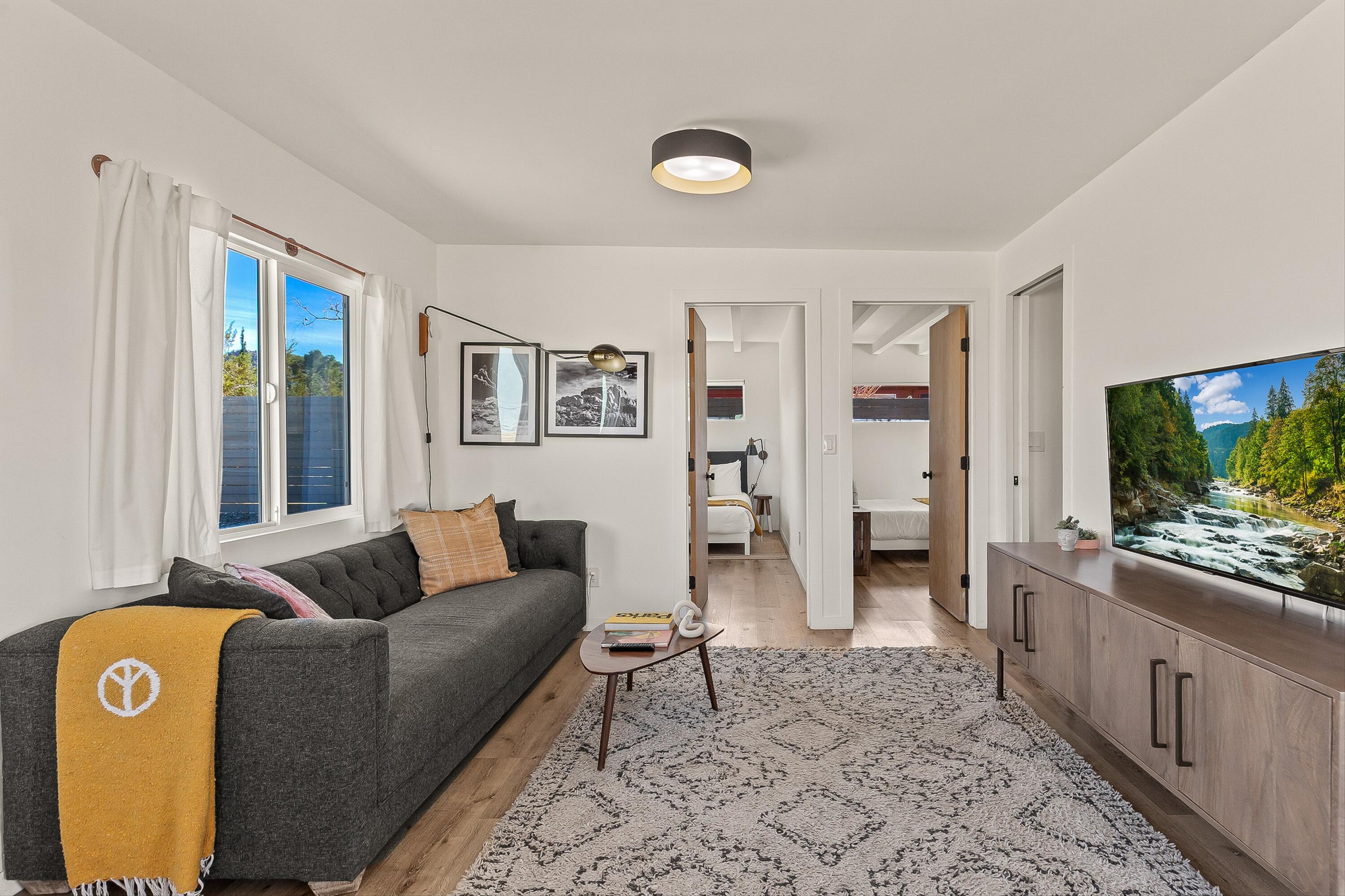 62010 El Reposo Circle Joshua Tree, CA 92252 - Photo 6 of 28 a living room with furniture and a flat screen tv