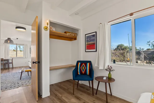 a workspace with furniture and window