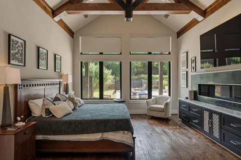 a bedroom with furniture and a fireplace