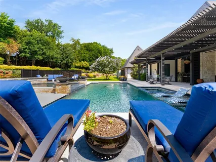 a view of a swimming pool with a patio