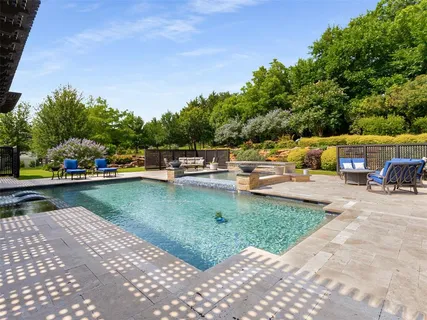 a view of a swimming pool with a patio