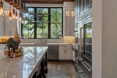 a kitchen with a sink and a stove
