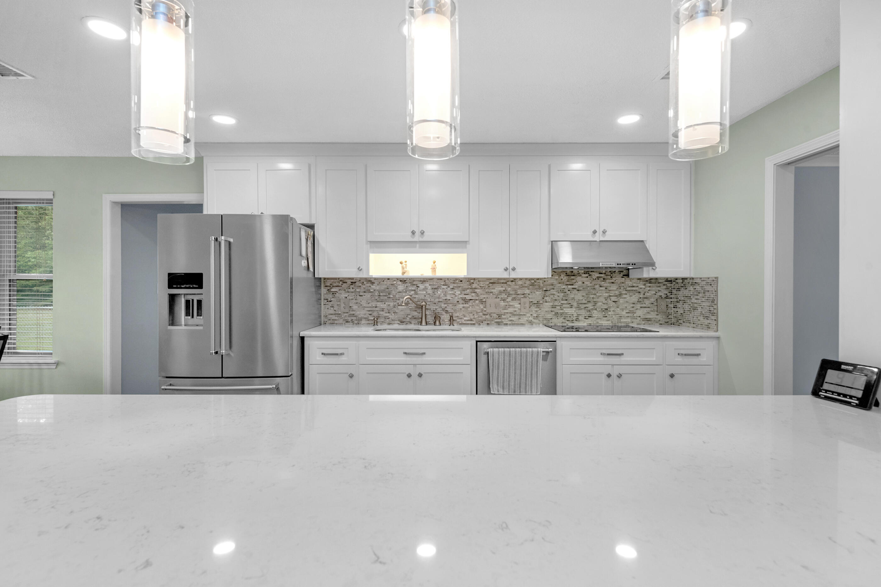 10099 Bellbrook Road Milton, FL 32583 - Photo 15 of 49 a kitchen with stainless steel appliances a refrigerator and a sink