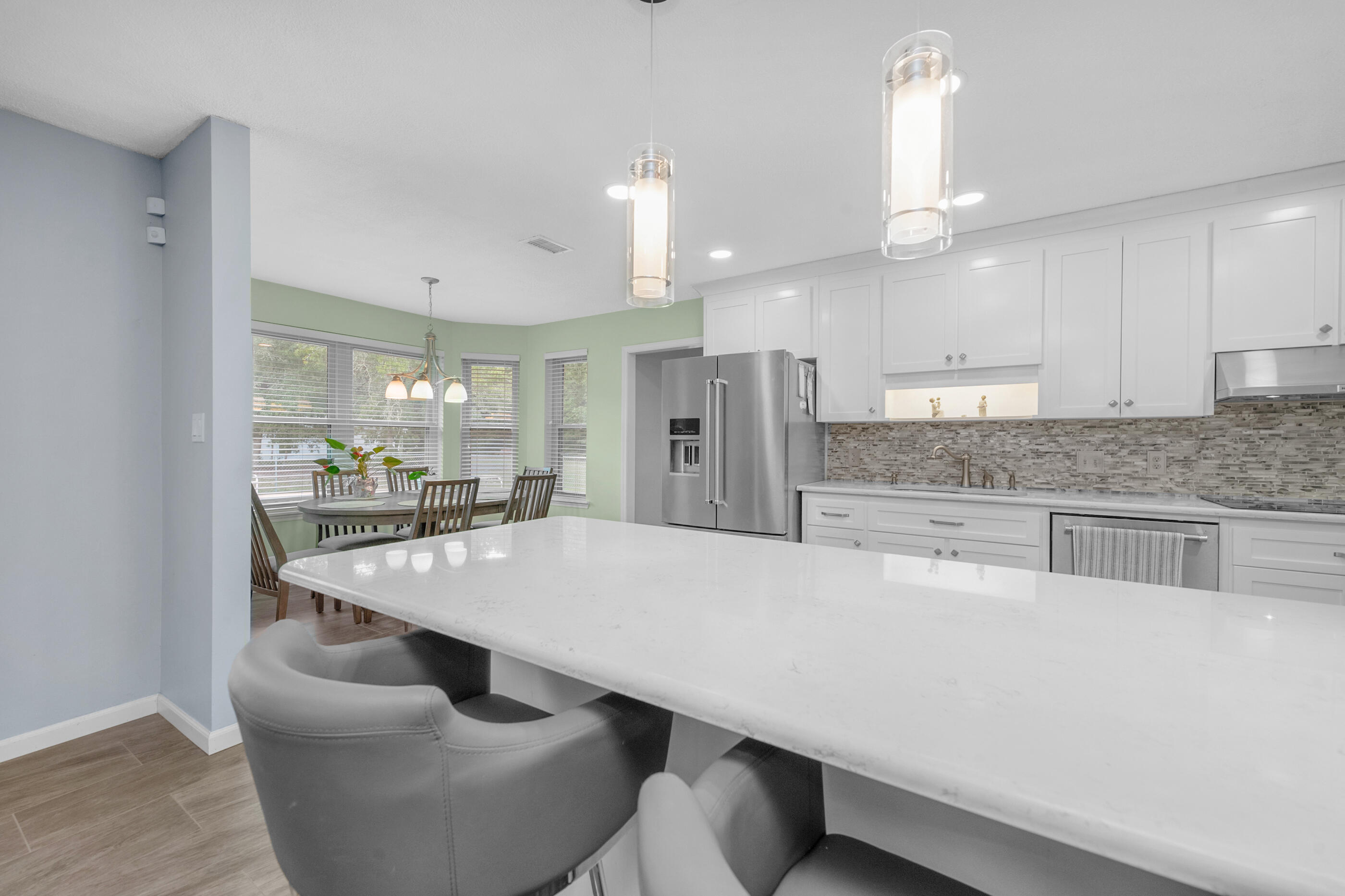 10099 Bellbrook Road Milton, FL 32583 - Photo 16 of 49 a large kitchen with a table and chairs