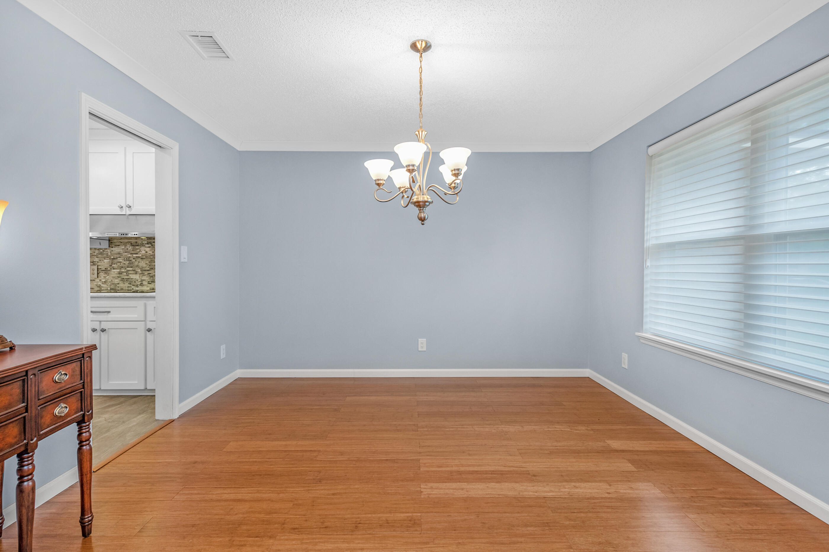 10099 Bellbrook Road Milton, FL 32583 - Photo 18 of 49 a view of a room with a window and chandelier fan
